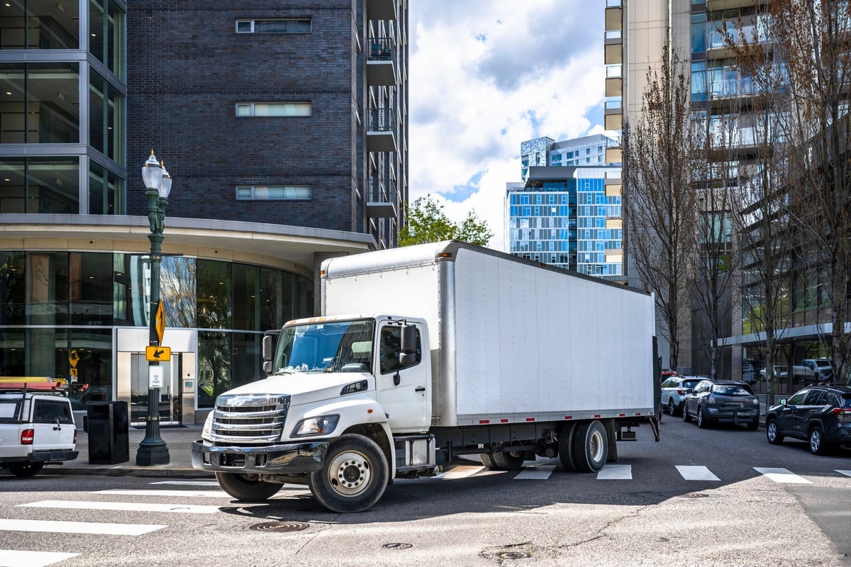 Box truck making a local commercial delivery on a city street